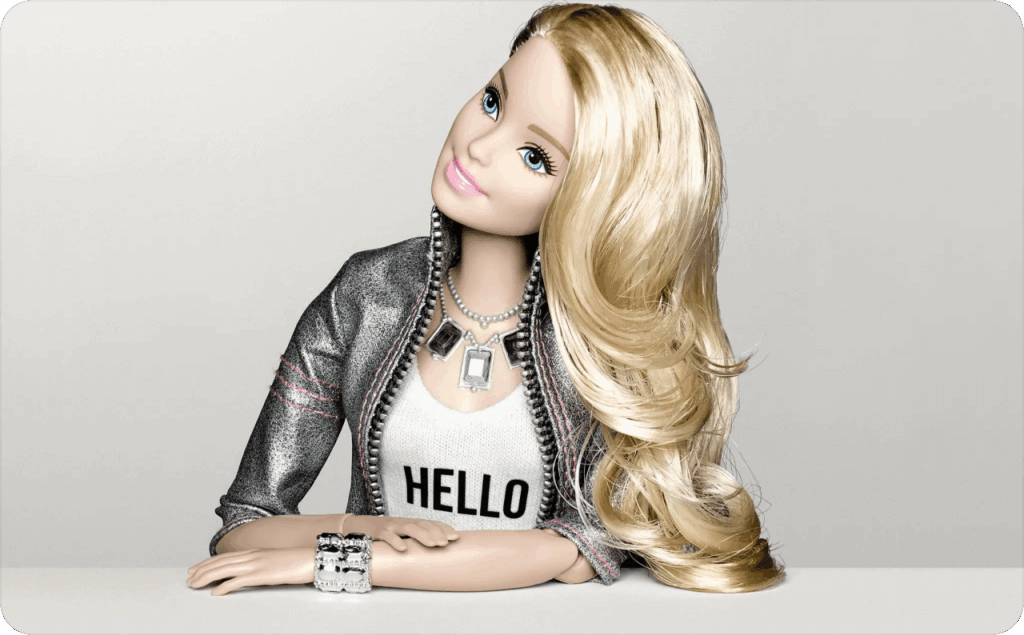Barbie with white hair in a black coat and a white T-shirt with the inscription hello