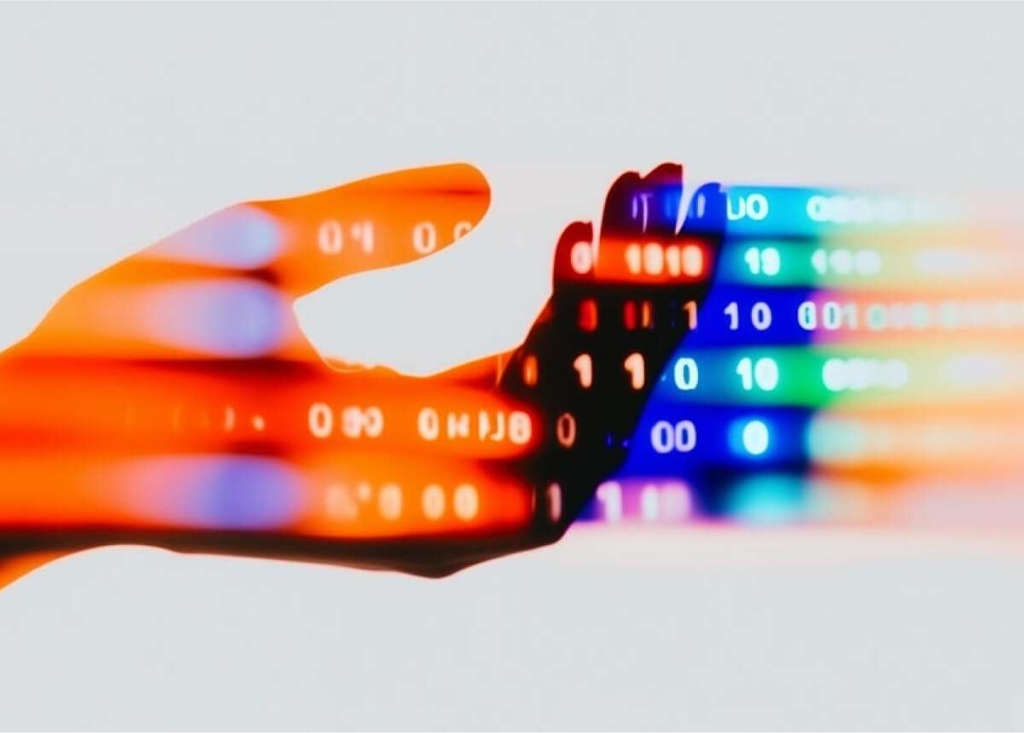 hand with code numbers show connection between human and AI
