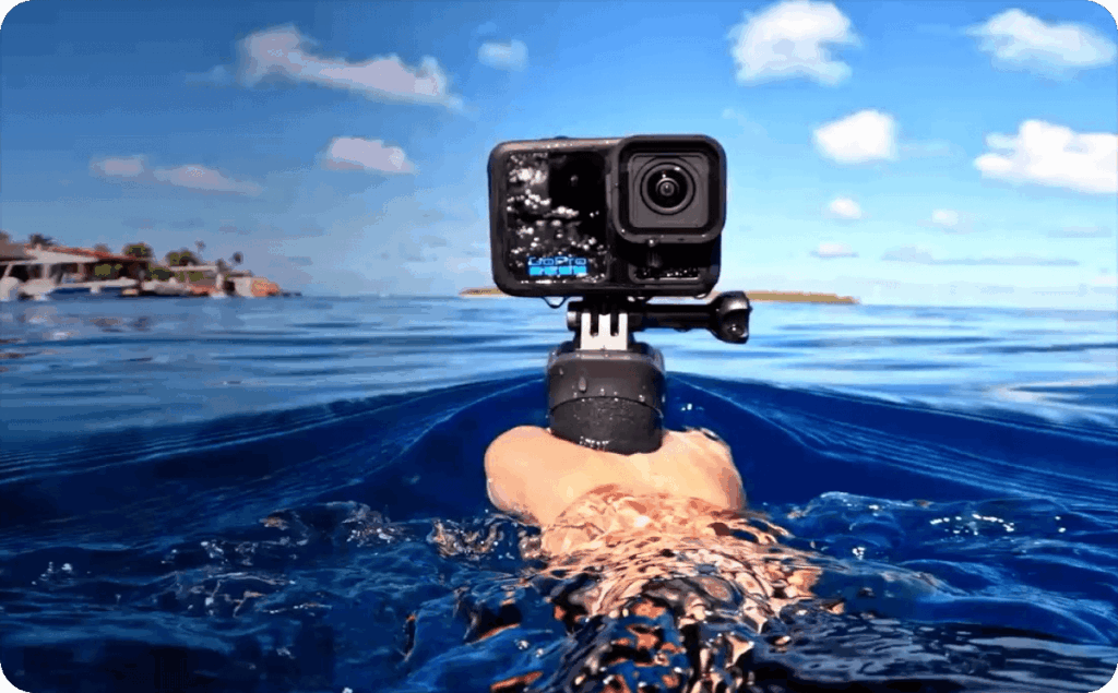 Hand with camera in water