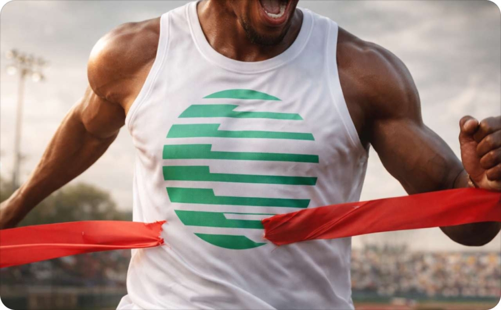 Athlete breaking through a red finish line ribbon on a stadium track, symbolizing performance and winning — Zeely vs competitors comparison concept.