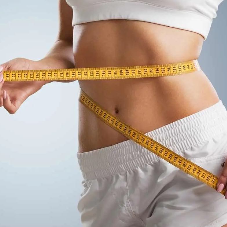 A woman with a tape measure